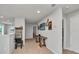 Upstairs hallway with decorative wall art and a console table at 8857 Rhodes St, Kissimmee, FL 34747