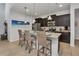 Modern kitchen with dark cabinets, granite counters and island at 8857 Rhodes St, Kissimmee, FL 34747