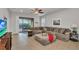 Spacious living room with sectional sofa and access to patio at 8857 Rhodes St, Kissimmee, FL 34747