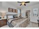 Main bedroom with king-size bed and ensuite bathroom access at 8857 Rhodes St, Kissimmee, FL 34747