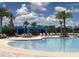 Relaxing pool area with lounge chairs at 8857 Rhodes St, Kissimmee, FL 34747