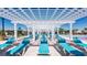 Resort-style pool deck with multiple lounge chairs under a pergola at 8857 Rhodes St, Kissimmee, FL 34747