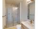 Bathroom featuring modern vanity, toilet and a glass enclosed shower with marble tile at 9819 Gobat Aly, Orlando, FL 32827