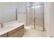 Bathroom featuring modern vanity, toilet and a glass enclosed shower with marble tile at 9819 Gobat Aly, Orlando, FL 32827
