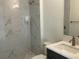 Bathroom featuring a stand up shower, a modern vanity, light walls, and contrasting accents at 9819 Gobat Aly, Orlando, FL 32827