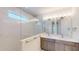 Modern bathroom featuring a double sink vanity and marble tiled glass enclosed shower at 9819 Gobat Aly, Orlando, FL 32827