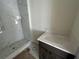 Bathroom with marble shower and vanity at 9819 Gobat Aly, Orlando, FL 32827