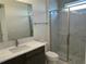 Modern bathroom with a glass-enclosed shower, marble countertops, and sleek fixtures for a spa-like feel at 9819 Gobat Aly, Orlando, FL 32827