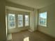 Spacious bedroom with three windows and natural light at 9819 Gobat Aly, Orlando, FL 32827