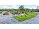 Beautiful community garden with raised beds, gravel paths, and decorative windmills at 9819 Gobat Aly, Orlando, FL 32827