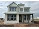 Two-story home with gray accents and a covered porch at 9819 Gobat Aly, Orlando, FL 32827