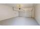 Spacious garage with an automatic door opener and concrete floors at 9819 Gobat Aly, Orlando, FL 32827