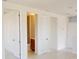 Bright interior space featuring white walls and trim with doorway access to an ensuite bathroom at 9819 Gobat Aly, Orlando, FL 32827