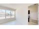 Bright room featuring a large window and a glimpse into a mudroom at 9819 Gobat Aly, Orlando, FL 32827