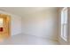 Bright and airy room with white walls and floors, ready for personalization and comfortable living at 9819 Gobat Aly, Orlando, FL 32827