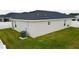 House exterior showcasing a sizable backyard at 1107 Tropea Ln, Auburndale, FL 33823