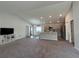 Open living room with high ceilings and neutral color palette at 1107 Tropea Ln, Auburndale, FL 33823
