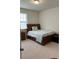 Bedroom with a queen-size bed and dresser at 11555 Charnock Dr, Windermere, FL 34786