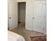 Bright bedroom with two closets and neutral carpeting at 11555 Charnock Dr, Windermere, FL 34786