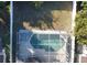 Overhead view of house and fenced backyard with pool at 12061 Greco Dr, Orlando, FL 32824