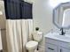 Bathroom boasts updated vanity, shower, and toilet at 12061 Greco Dr, Orlando, FL 32824