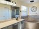Bathroom boasts double vanity, garden tub, and separate shower at 12061 Greco Dr, Orlando, FL 32824
