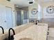 Double vanity bathroom with modern fixtures and large mirror at 12061 Greco Dr, Orlando, FL 32824