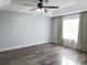 Spacious bedroom with wood-look floors and large window at 12061 Greco Dr, Orlando, FL 32824