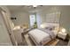 Virtually staged bedroom with full-size bed and modern decor at 12061 Greco Dr, Orlando, FL 32824