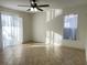 Spacious bedroom with tile floors and sliding doors at 12061 Greco Dr, Orlando, FL 32824