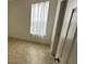 Bright bedroom with tile floors and large window at 12061 Greco Dr, Orlando, FL 32824