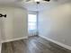 Simple bedroom with ceiling fan and hardwood floors at 12061 Greco Dr, Orlando, FL 32824