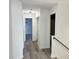 Light-filled hallway with doors to bedrooms and closets at 12061 Greco Dr, Orlando, FL 32824
