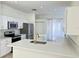 Modern kitchen with white cabinets and gold hardware at 12061 Greco Dr, Orlando, FL 32824