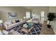 Virtually staged living room with comfy furniture at 12061 Greco Dr, Orlando, FL 32824