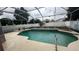 Screened pool with tiled deck and fountain at 12061 Greco Dr, Orlando, FL 32824