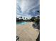 Community pool with lounge chairs at 12061 Greco Dr, Orlando, FL 32824
