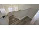 Modern staircase with wood-look flooring at 12061 Greco Dr, Orlando, FL 32824