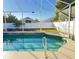 Inviting swimming pool with a screened enclosure at 12061 Greco Dr, Orlando, FL 32824