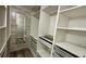 Large walk-in closet with ample shelving and drawers at 12061 Greco Dr, Orlando, FL 32824