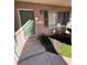 Exterior view of condo with green door, window, and landscaping at 122 Waterfront Way # 110, Altamonte Springs, FL 32701