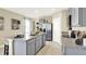 Open kitchen with stainless steel appliances and granite countertops at 1300 Cascades Ave, Davenport, FL 33837