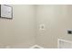 Simple laundry room with hookups and light wall color at 1300 Cascades Ave, Davenport, FL 33837