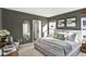 Main bedroom with a king-size bed and en-suite bathroom at 1300 Cascades Ave, Davenport, FL 33837