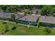 Aerial view of a charming home with a large, well-maintained backyard, surrounded by lush greenery at 1433 Lake Marion Dr, Apopka, FL 32712