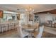 Cozy dining area with a charming round table, comfortable chairs, and a lovely view into the kitchen at 1433 Lake Marion Dr, Apopka, FL 32712