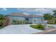 Inviting single-story home with a spacious driveway, lovely landscaping, and a welcoming mailbox area at 1433 Lake Marion Dr, Apopka, FL 32712