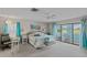 Serene primary bedroom with soft decor, a ceiling fan, and sliding glass doors to the outdoors at 1433 Lake Marion Dr, Apopka, FL 32712