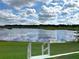 Scenic water view with a lush green lawn and a staircase leading down to the water at 1433 Lake Marion Dr, Apopka, FL 32712