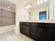 Bathroom with double vanity and shower/tub combo at 15137 Shonan Gold Dr, Winter Garden, FL 34787